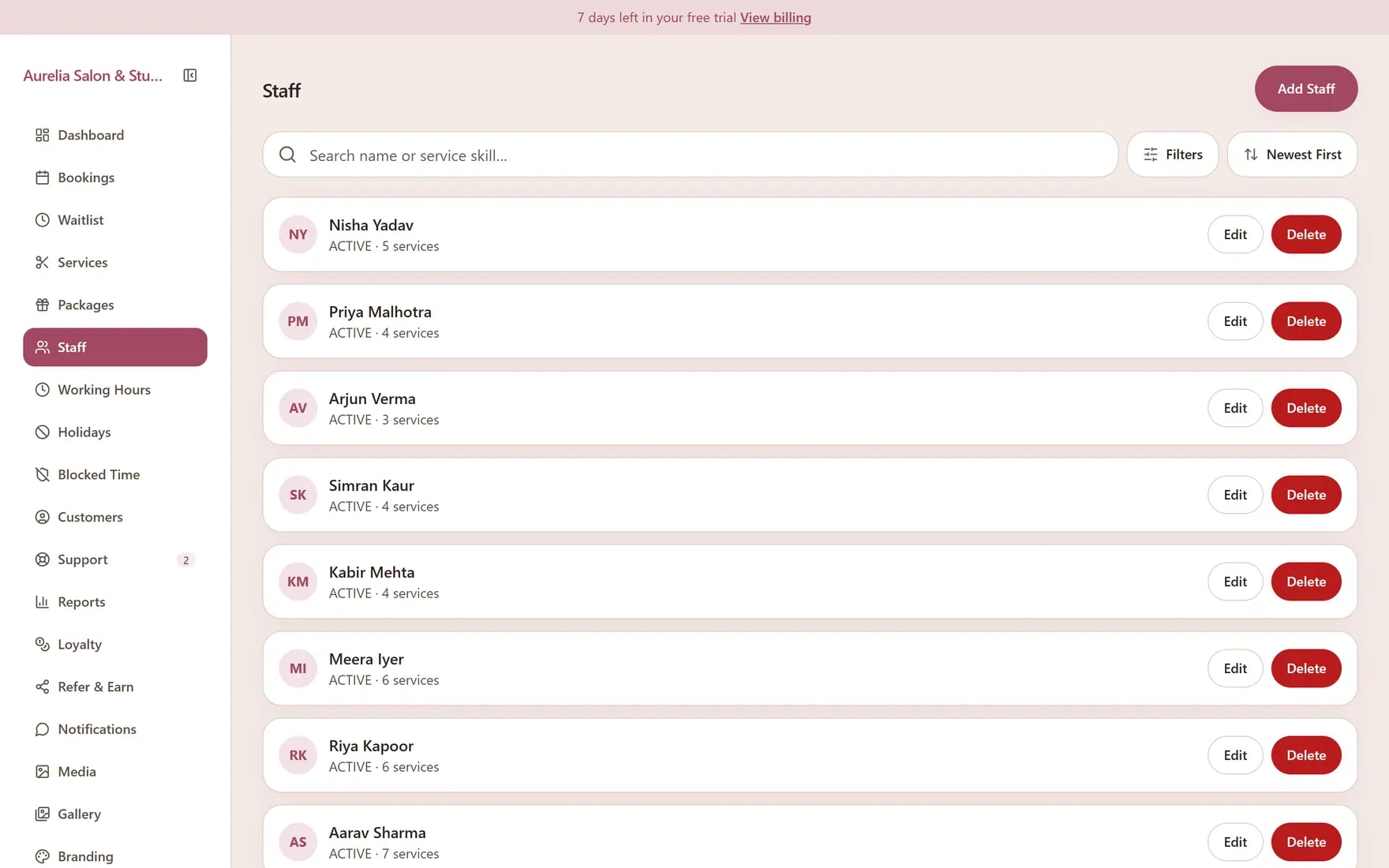 Apptzy staff list with stylists, active status, and the services each person offers.